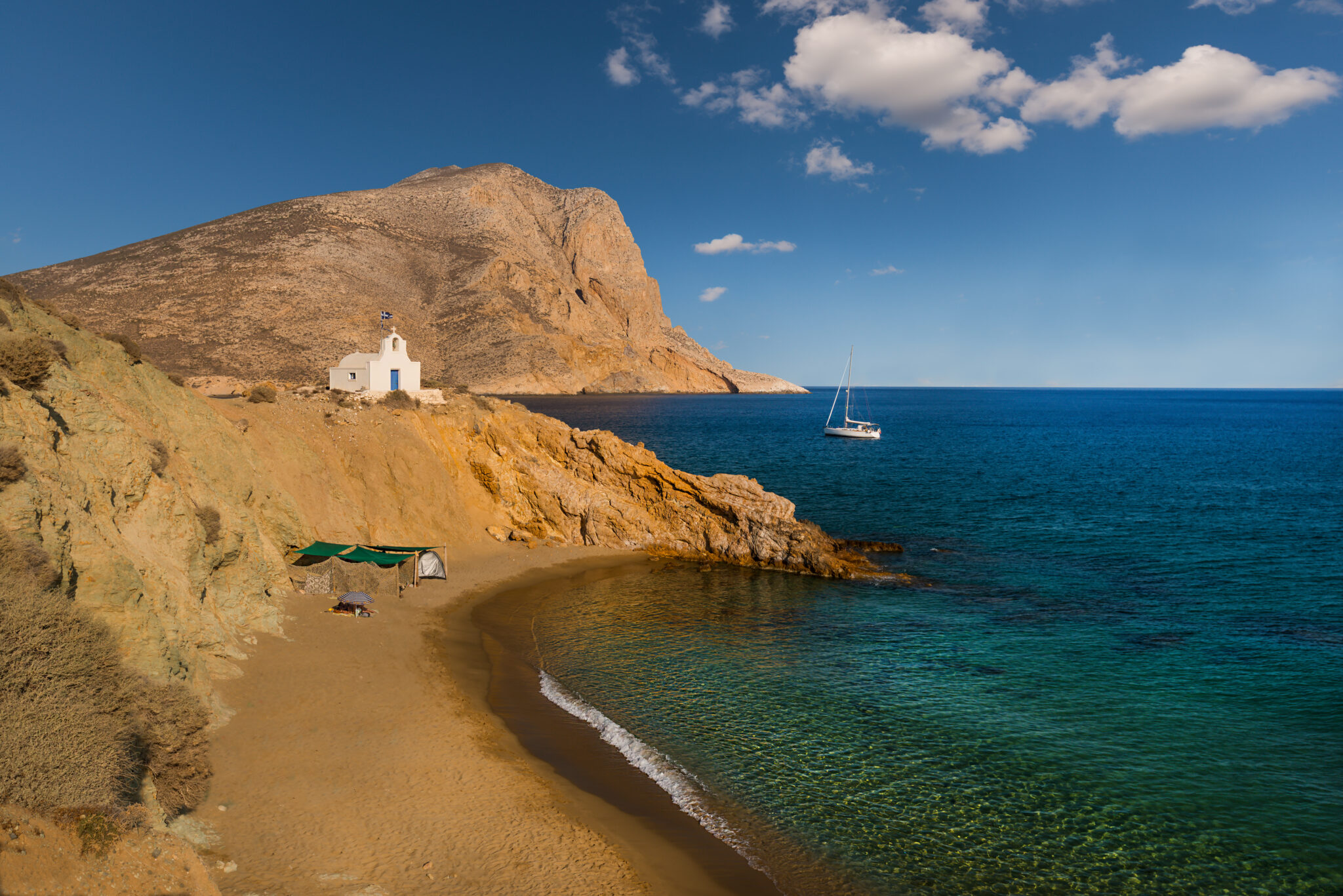 Small,Church,And,Sailboat,At,Anchor,In,The,Bay,On